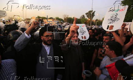 Supporters of Hezbollah Brigades protest against the killing of Nasrallah, in central Baghdad