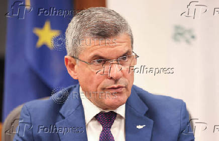 Cyprus' Minister of Energy, Commerce and Industry George Papanastasiou speaks during an interview with Reuters at his office in the ministry in Nicosia