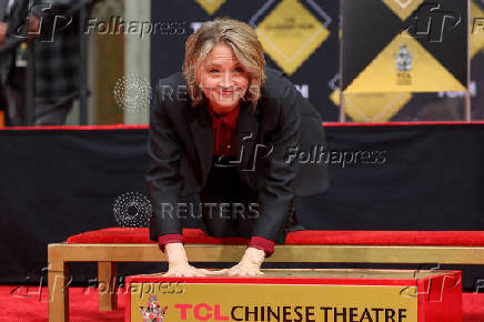 Actor Jodie Foster places her handprints in cement at the forecourt of the TCL Chinese Theatre, in Los Angeles