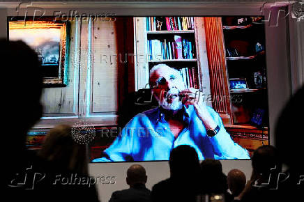 FILE PHOTO: Carl Icahn, chairman of Icahn Enterprises LP, speaks via video during the 13D Monitor's Active-Passive Investor Summit in New York