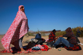 Migrants seeking asylum in the United States gather on the banks of the Rio Bravo river in Ciudad Juarez