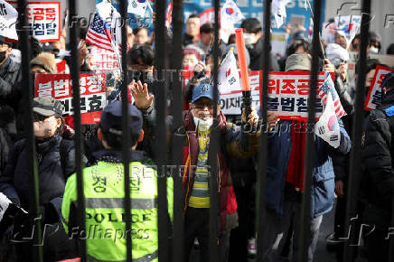 Pro-Yoon protesters participate in a rally outside a court, in Seoul