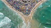 A drone view shows people enjoying the Macumba beach, during a heatwave in Rio de Janeiro