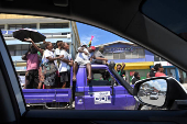 Supporters of former prime minister Gordon Darcy Lilo cheer and wave ahead of the election in the capital Honiara