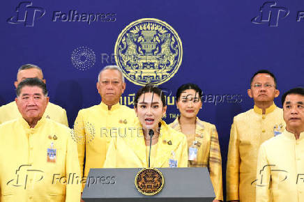 Thailand's Prime Minister Paetongtarn Shinawatra and her cabinet members attend a press conference in Bangkok