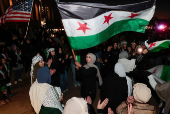 Syrian-Americans and supporters celebrate after Syrian rebels announced that they have ousted President Bashar al-Assad in Syria, in Dearborn