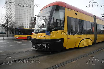 A tram with a European Union flag drives in Warsaw