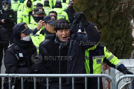 Pro-Yoon protesters participate in a rally outside a court, in Seoul