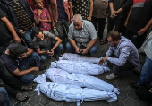 A Palestinian mother and her children killed following fresh Israeli strikes in central Gaza Strip