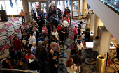 Supporters go thru security before seeing Tulsi Gabbard and Robert F. Kennedy Jr. take part in a moderated discussion with actor Zachary Levi in Dearborn