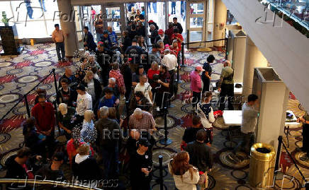 Supporters go thru security before seeing Tulsi Gabbard and Robert F. Kennedy Jr. take part in a moderated discussion with actor Zachary Levi in Dearborn