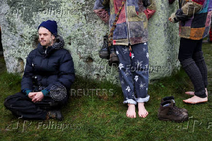 Revellers attend winter solstice celebrations at Stonehenge stone circle near Amesbury