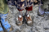 Afghans living in a camp amidst drop in temperatures in Kabul