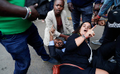 Kenyan activists and civil society representatives gather to deliver a list of people who disappeared during demonstrations against the government proposed tax hikes, in Nairobi