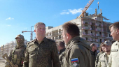 Russian Deputy Defence Minister Timur Ivanov inspects the construction of apartment blocks in Mariupol