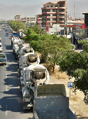 Vehicles wait in line to refuel with diesel, in Cochabamba