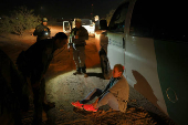 Migrants are detained by U.S. Border Patrol agents in New Mexico