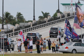 The motorcade carrying U.S. President-elect Trump departs Palm Beach