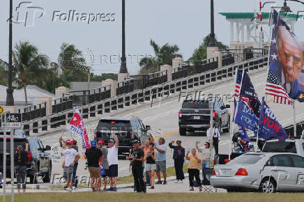 The motorcade carrying U.S. President-elect Trump departs Palm Beach