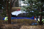 A motorcade believed to be carrying South Korea's impeached President Yoon Suk Yeol arrives at a court, in Seoul