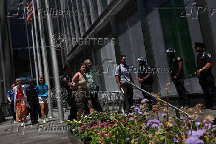 Climate control activists are led away by NYPD in handcuffs after protesting outside the global headquarters of Citigroup in New York City