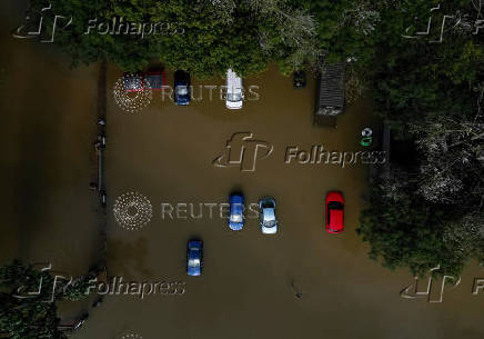 A drone view shows stranded vehicles at White Mills Marina after heavy rain and flooding in Northampton