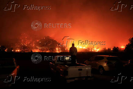 Smoke billows from the Mountain Fire, in California