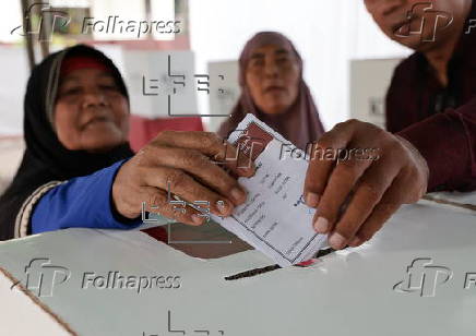 Voters cast their ballows in regional government elections in Indonesia