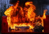 Fire department in Berlin demonstrates fire hazard from Christmas tree candles