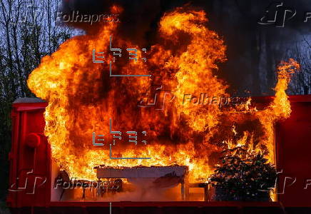 Fire department in Berlin demonstrates fire hazard from Christmas tree candles