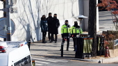 Police stand guard outside presidential residence in Seoul