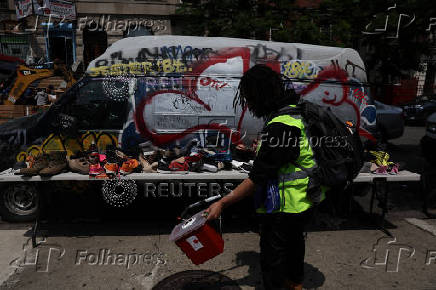 Member from OnPoint NYC cleans up syringes in Bronx, New York City