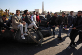 People gather in Umayyad Square after Syria's Bashar al-Assad was ousted in central Damascus