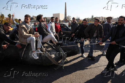 People gather in Umayyad Square after Syria's Bashar al-Assad was ousted in central Damascus