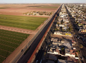 View of the wall on the United States and Mexico border in Mexicali