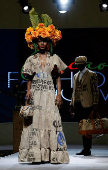 Models present clothing made from used cocoa sacks during the ninth edition of the National Cocoa and Chocolate Days in Abidjan