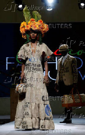 Models present clothing made from used cocoa sacks during the ninth edition of the National Cocoa and Chocolate Days in Abidjan