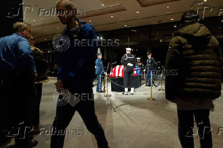 Mourners view the casket of former President Jimmy Carter in Atlanta