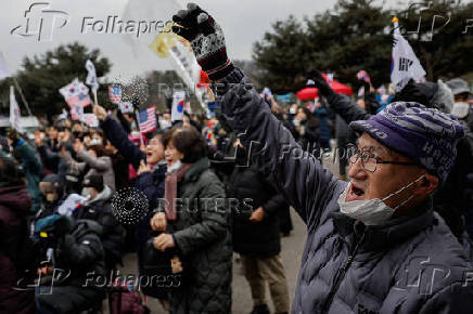 Pro-Yoon supporters participate in a rally outside the Seoul Detention Center in Uiwang