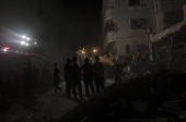 Palestinians search for victims after an Israeli air strike in the Rafah refugee camp