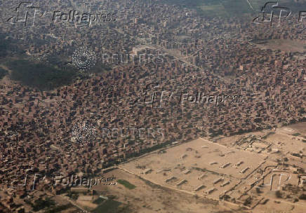 An aerial view shows houses and agricultural land in Cairo