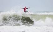 Surfing Santas take to the waves at the annual Christmas Eve event in Cocoa Beach