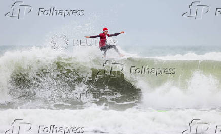 Surfing Santas take to the waves at the annual Christmas Eve event in Cocoa Beach