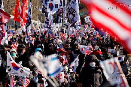 Impeached South Korean President Yoon Suk Yeol's supporters rally near the Corruption Investigation Office for High-ranking Officials, following his arrest, in Gwacheon