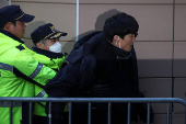 Pro-Yoon protesters participate in a rally outside a court, in Seoul