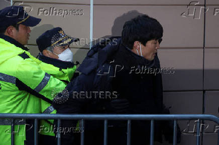 Pro-Yoon protesters participate in a rally outside a court, in Seoul