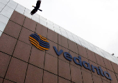 FILE PHOTO: A bird flies by the Vedanta office building in Mumbai
