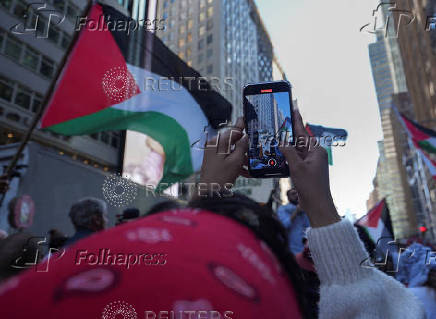 People walk in demonstration, nearly one year after Hamas' October 7, 2023 attack in southern Israel, in New York City