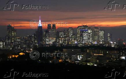 FILE PHOTO: High-rise buildings are seen at the Shinjuku business district during sunset in Tokyo