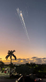 Orange balls of light fly across the sky as debris from a SpaceX rocket launched in Texas is spotted over Turks and Caicos Islands